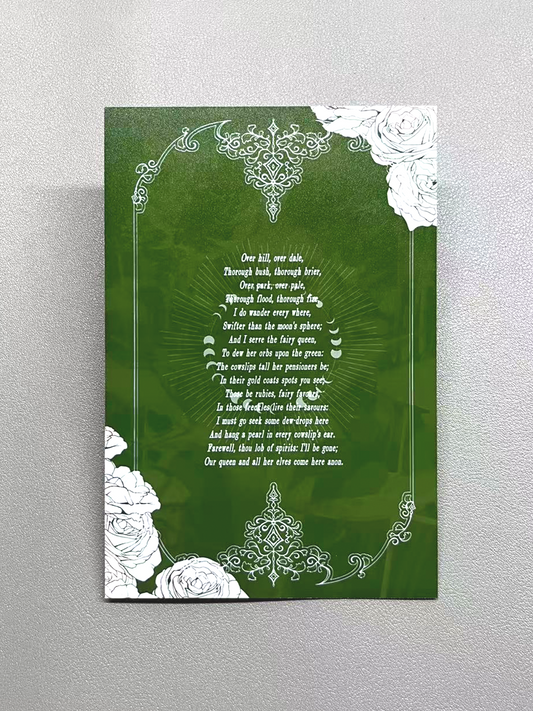 Back view of the Astarion "Midsummer Reverse" card showing the dark green floral design and literary text, thick durable collectible card stock.
