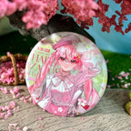 Front view of Miku glitter badge fan merchandise by AO Treehouse.